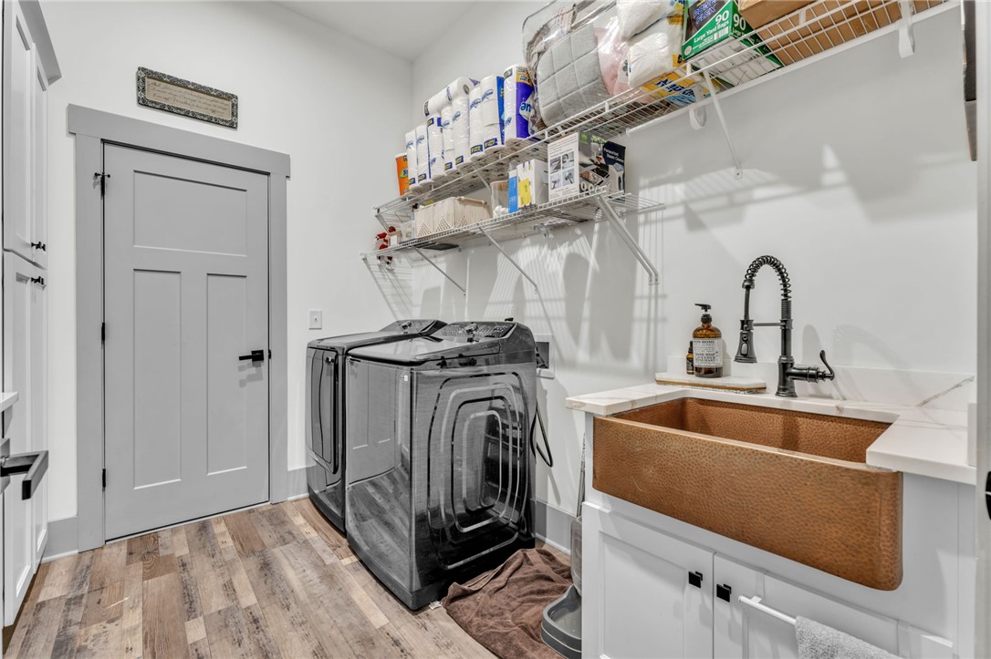 919 Watercrest Road West Union, SC 29696 - Photo 32 of 50 This functional laundry room features modern appliances and practical storage solutions.