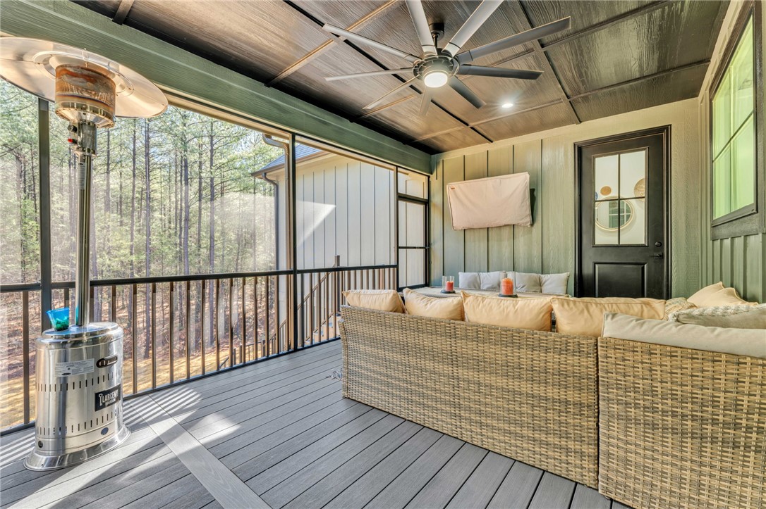 919 Watercrest Road West Union, SC 29696 - Photo 34 of 50 This inviting porch offers a tranquil retreat amidst nature, perfect for relaxation and gatherings.