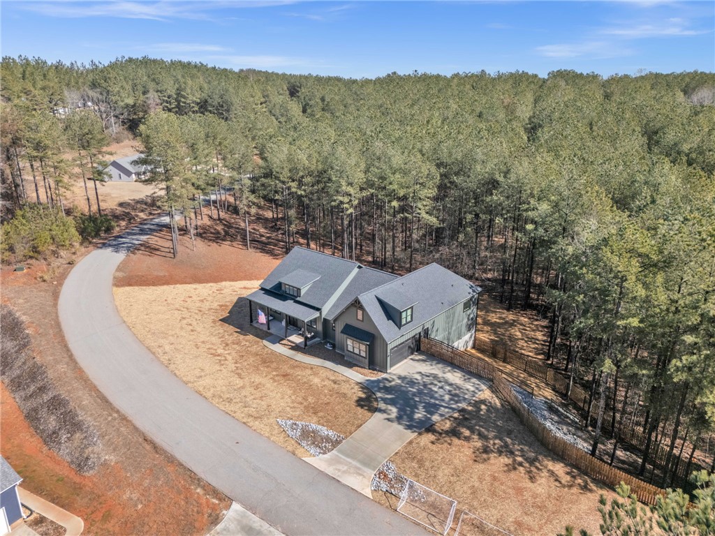 919 Watercrest Road West Union, SC 29696 - Photo 39 of 50 This contemporary residence is nestled among mature trees, offering a tranquil retreat with ample privacy.