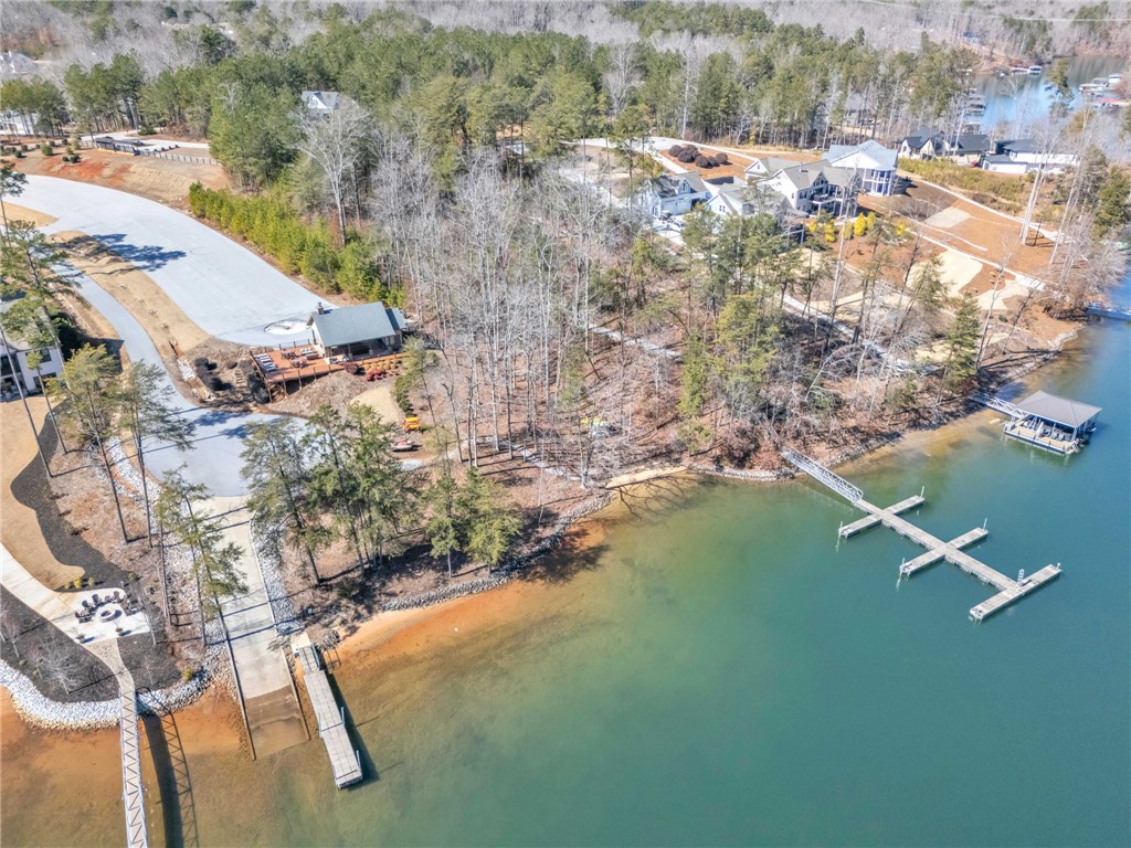 919 Watercrest Road West Union, SC 29696 - Photo 45 of 50 This aerial view showcases a picturesque waterfront community with private docks, ramp, and beach area