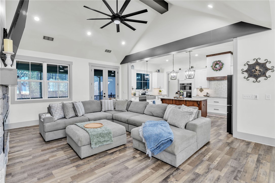 919 Watercrest Road West Union, SC 29696 - Photo 5 of 50 An inviting open-concept living space features high ceilings and elegant flooring.