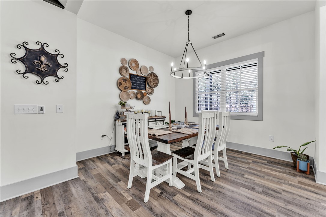 919 Watercrest Road West Union, SC 29696 - Photo 7 of 50 This bright dining area features an elegant chandelier and warm wood flooring.