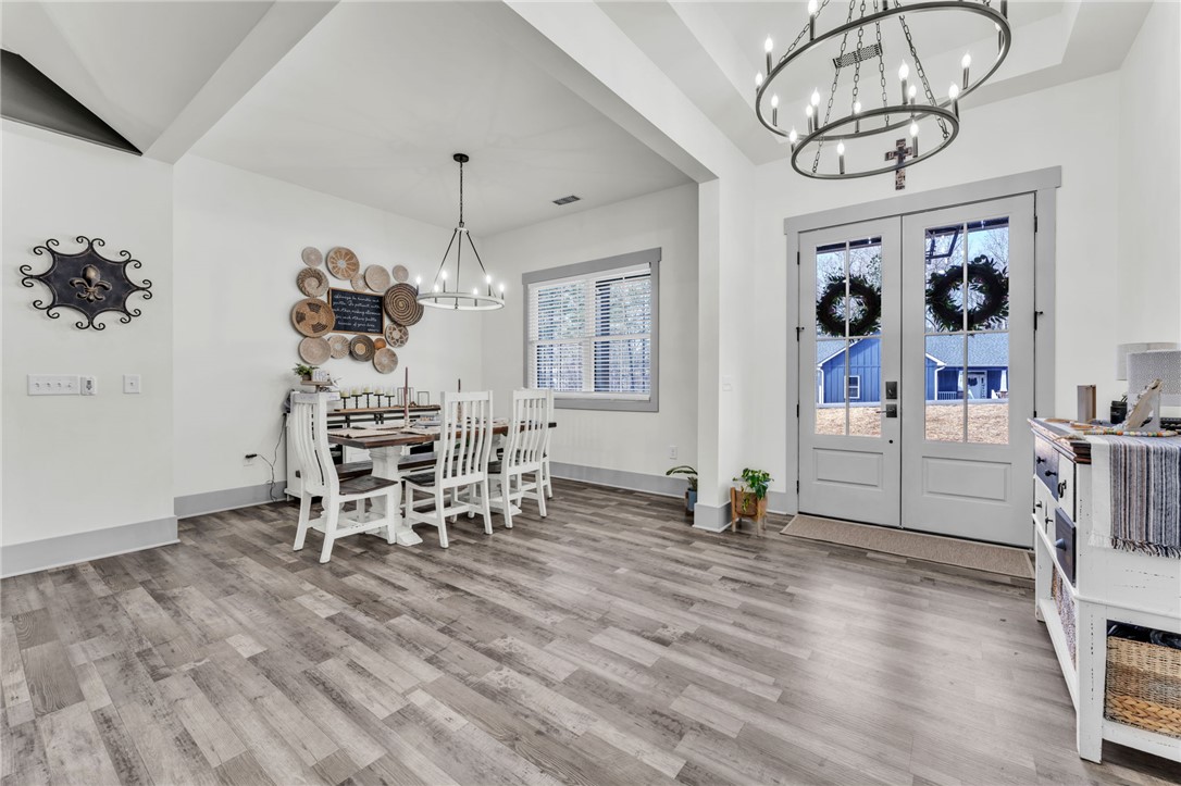 919 Watercrest Road West Union, SC 29696 - Photo 8 of 50 This inviting dining area features elegant fixtures, offering a perfect setting for gatherings.