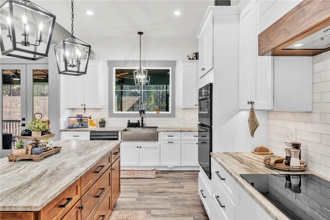 919 Watercrest Road West Union, SC 29696 - Photo 9 of 50 This bright kitchen features sleek appliances, ample counter space, and a generous island for gathering.