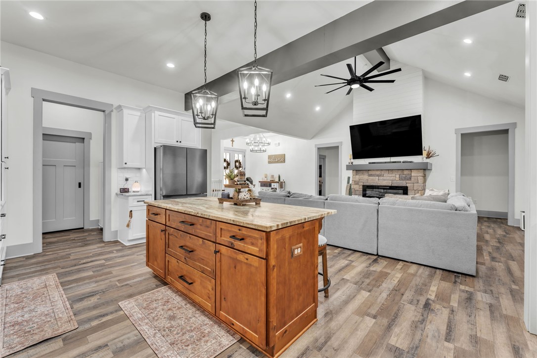 919 Watercrest Road West Union, SC 29696 - Photo 10 of 50 This bright and airy open-concept space features a well-appointed kitchen island and a cozy living area.