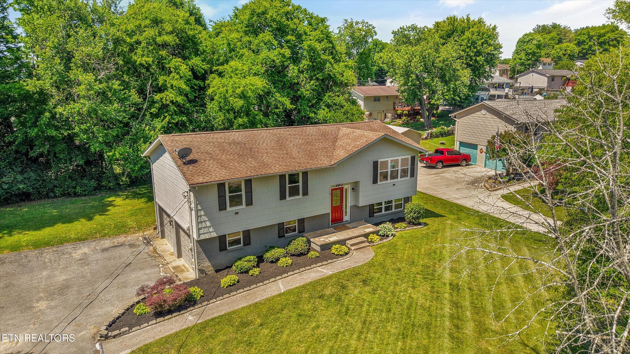 7613 Fall Wind Court Powell, TN 37849 - Photo 34 of 38 an aerial view of a house with swimming pool and large trees