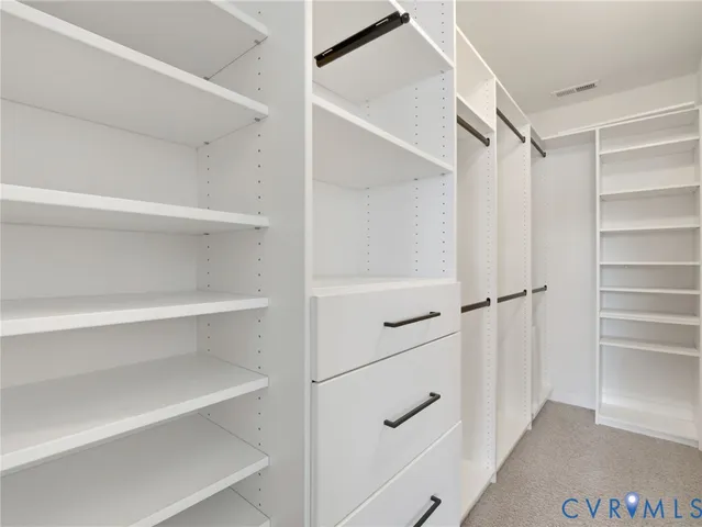 a bathroom with a sink double vanity and a mirror