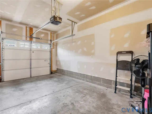 a front view of a house with a garden and patio