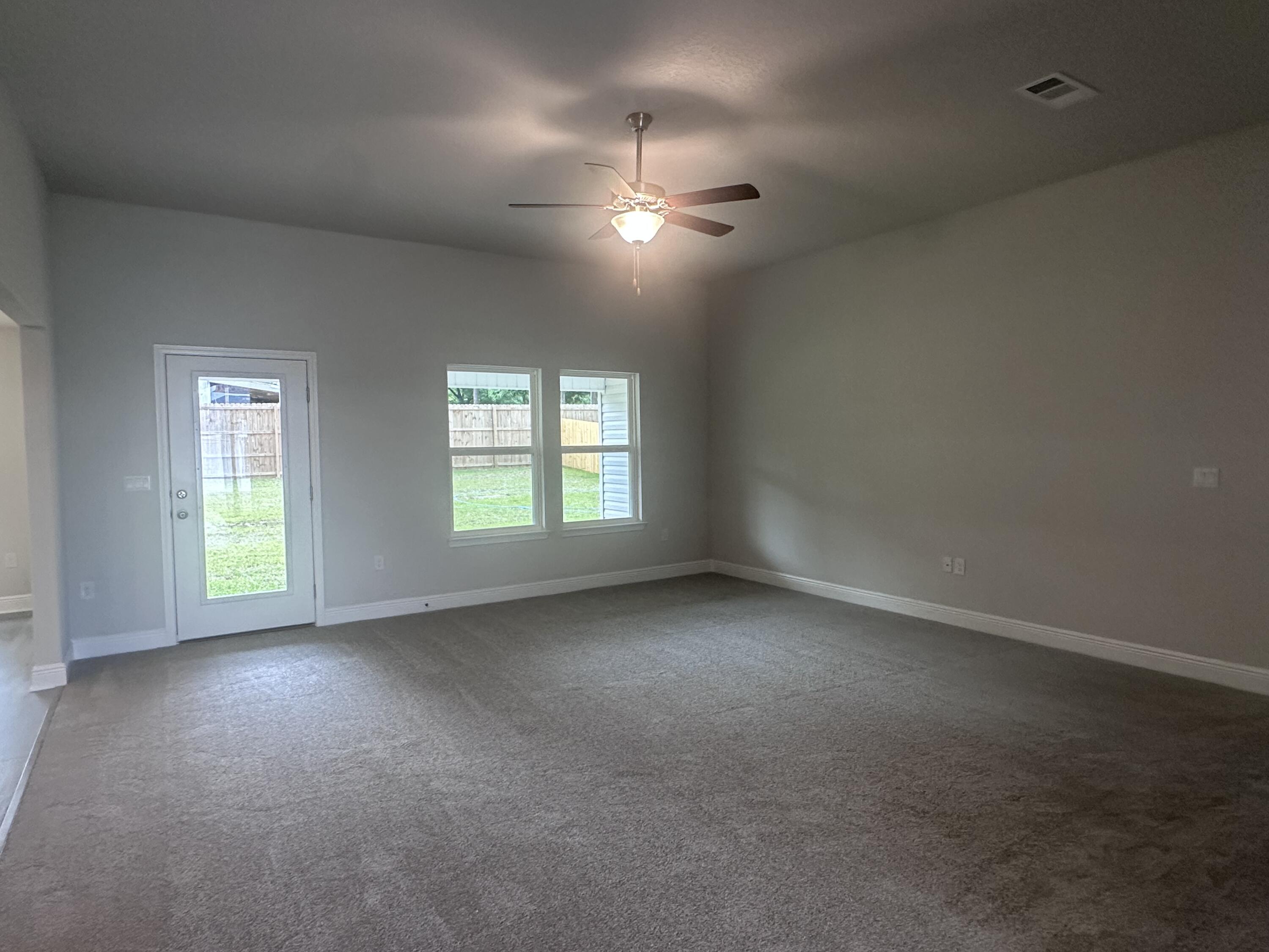 6115 Buckshot Drive Crestview, FL 32539 - Photo 11 of 29 an empty room with a empty space and windows