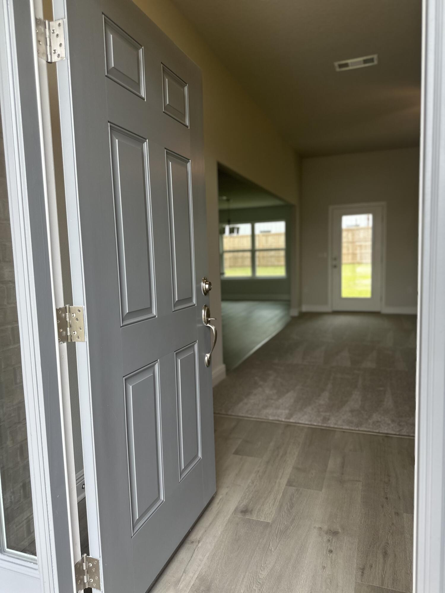 6115 Buckshot Drive Crestview, FL 32539 - Photo 25 of 29 a view of an entryway door with a living room