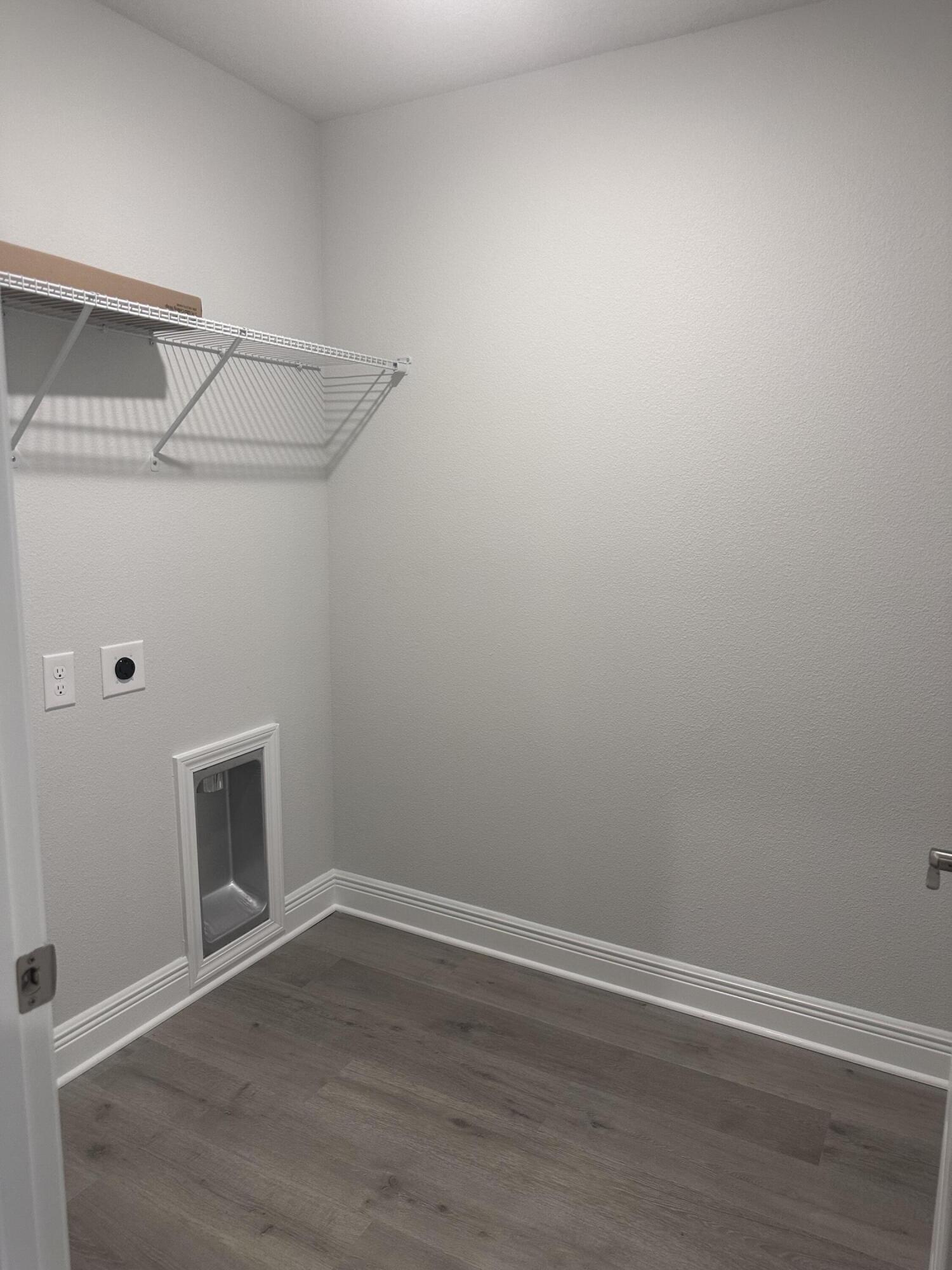 6115 Buckshot Drive Crestview, FL 32539 - Photo 27 of 29 a view of an empty room with wooden floor and a window