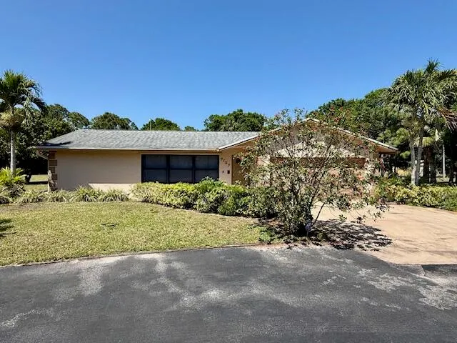a kitchen with a refrigerator and cabinets