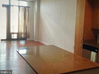 440 L Street Northwest, Unit 1112 Washington, DC 20001 - Photo 14 of 20 an empty room with wooden floor