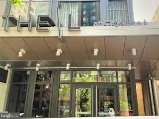 a front view of a building with glass windows and door