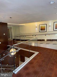 440 L Street Northwest, Unit 1112 Washington, DC 20001 - Photo 10 of 20 a room with wooden floor