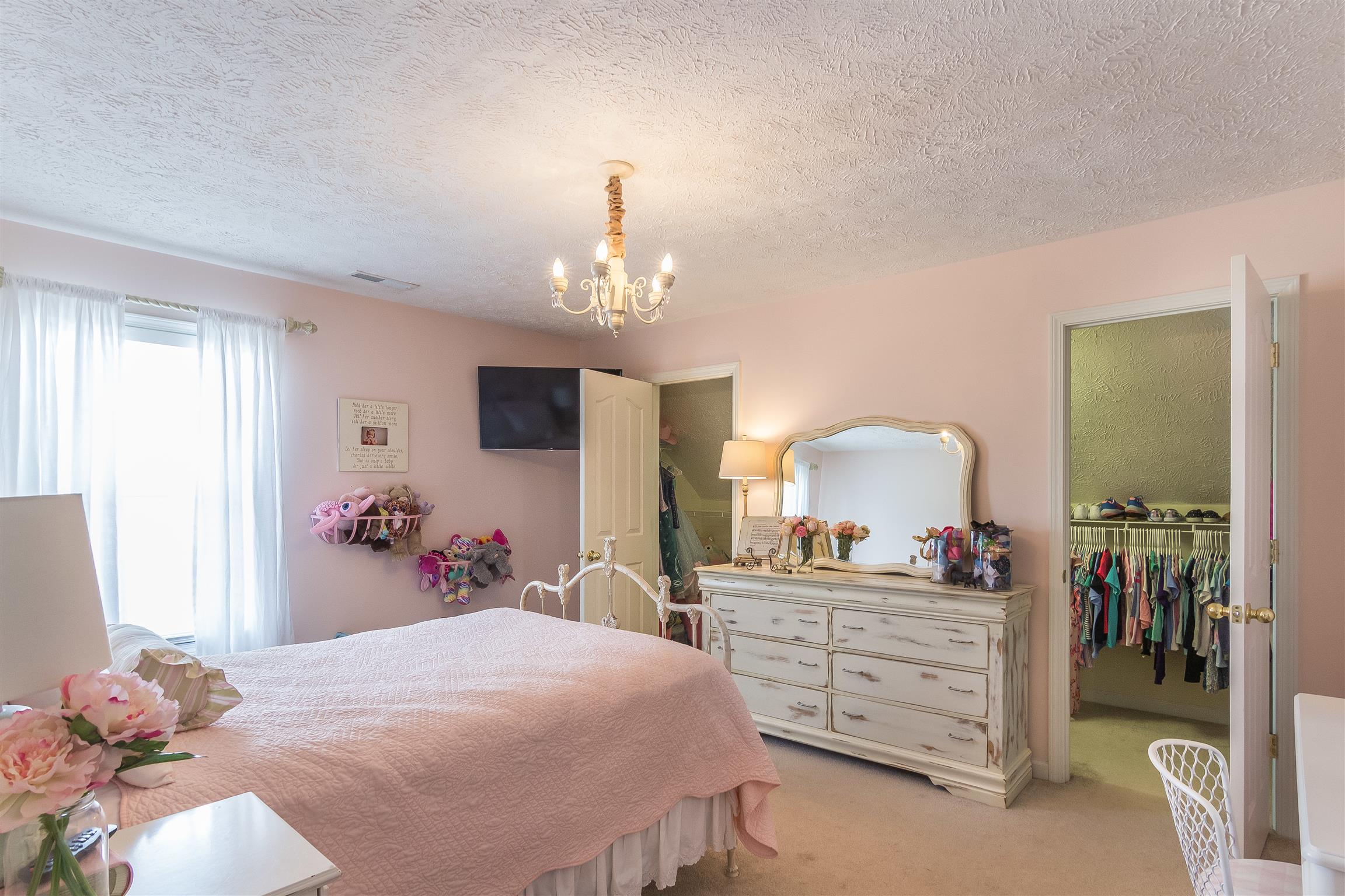 14136 Mt Pleasant Road Rockvale, TN 37153 - Photo 14 of 21 a bed room with a bed and a chandelier