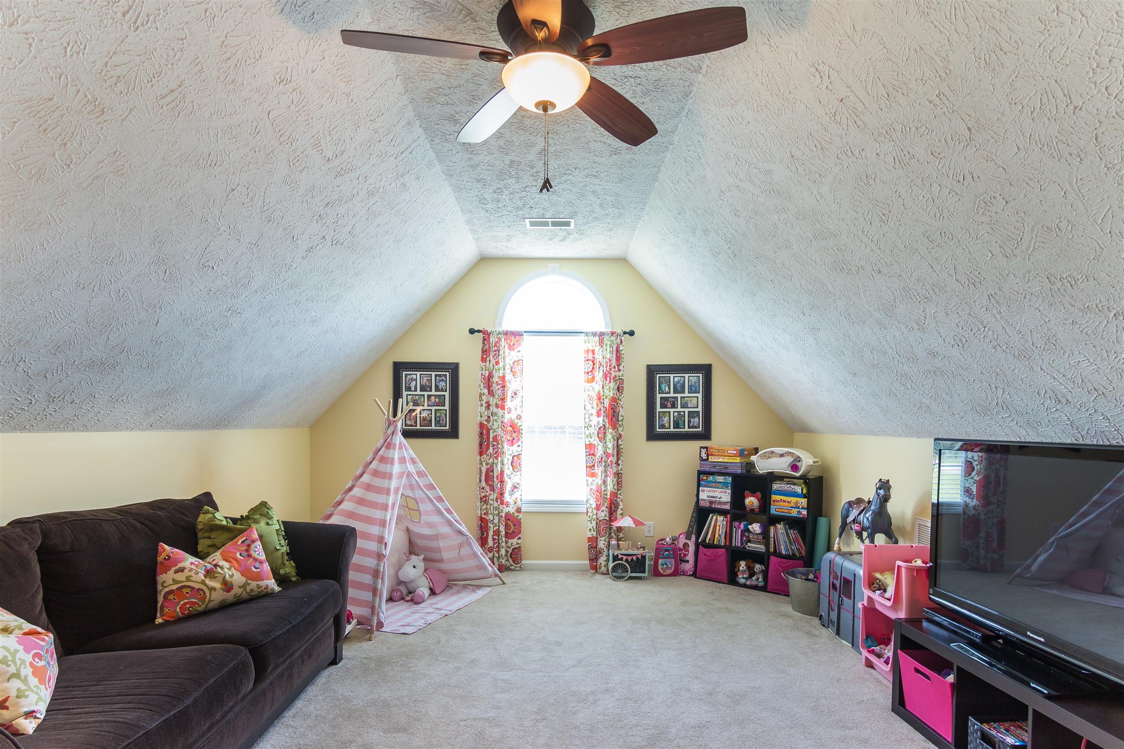 14136 Mt Pleasant Road Rockvale, TN 37153 - Photo 16 of 21 a bedroom with furniture and a chandelier