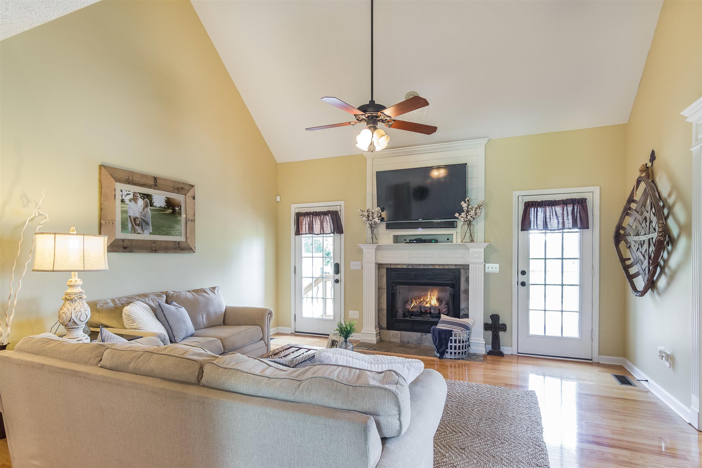 14136 Mt Pleasant Road Rockvale, TN 37153 - Photo 4 of 21 a living room with furniture a fireplace and a flat screen tv