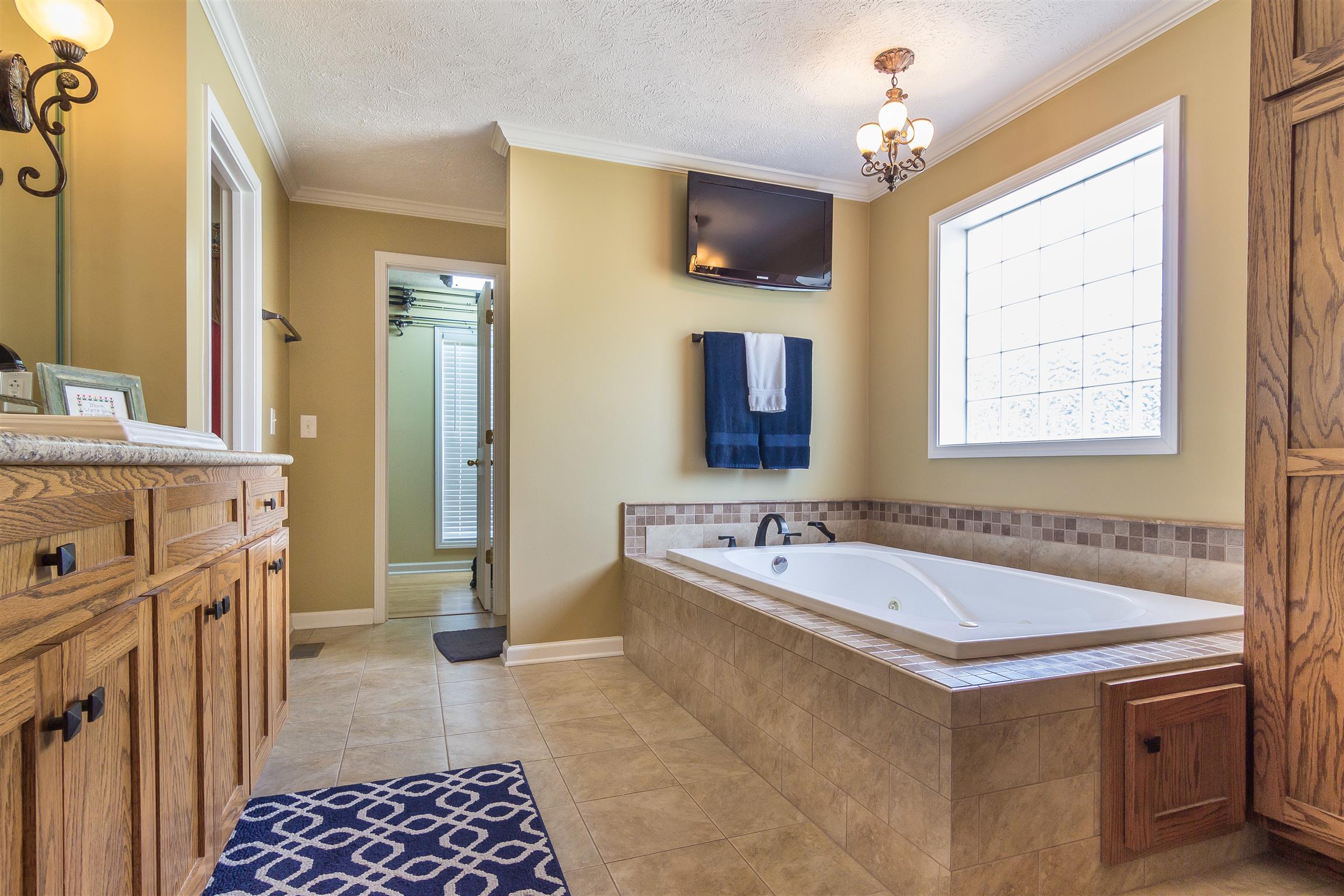 14136 Mt Pleasant Road Rockvale, TN 37153 - Photo 9 of 21 a spacious bathroom with a tub sink and mirror