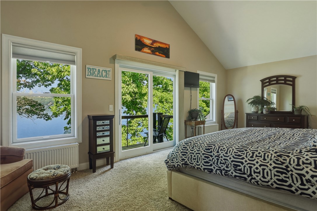 5580 Peach Orchard Road Hector, NY 14841 - Photo 21 of 50 Primary bedroom with sliding glass doors leading t