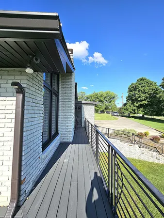 a view of balcony with wooden floor