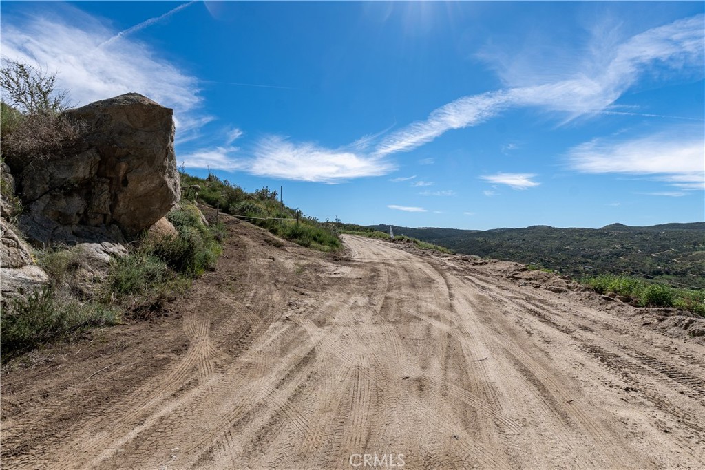 0 Webber Way Hemet, CA 92544 - Photo 29 of 33 a view of a dry yard with wooden fence