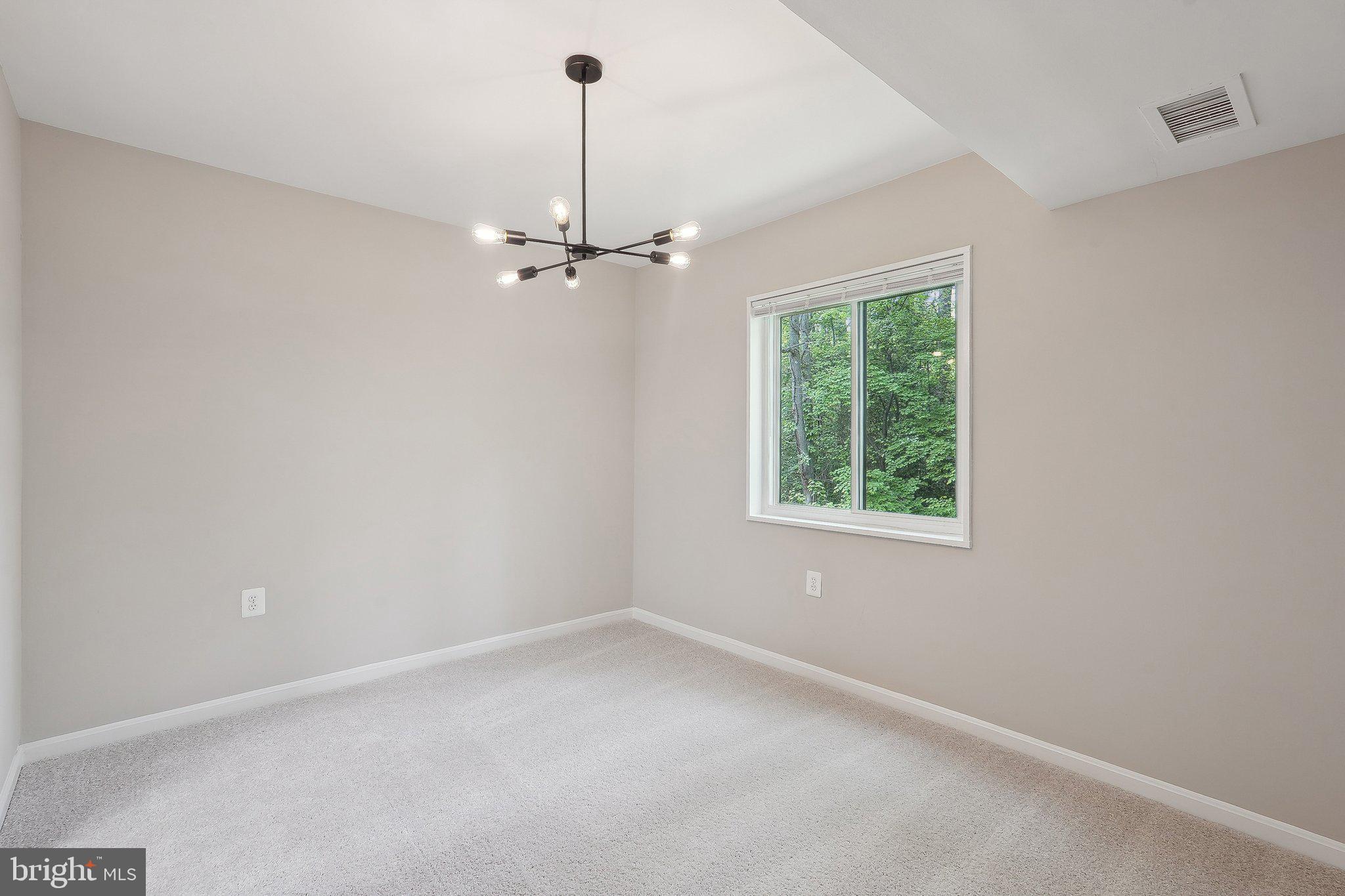 1531 Northgate Square, Unit 12B Reston, VA 20190 - Photo 11 of 34 a view of an empty room with windows