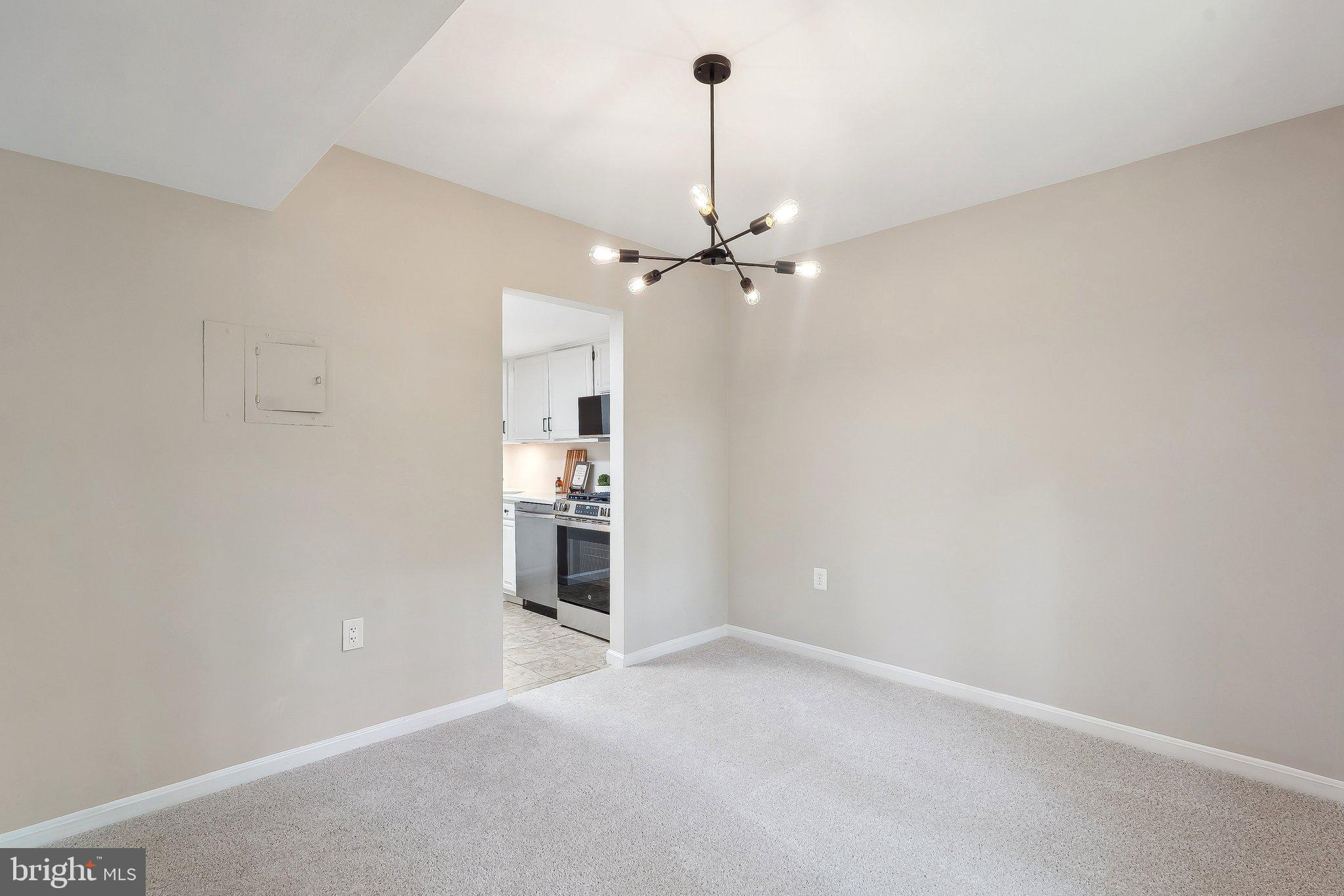 1531 Northgate Square, Unit 12B Reston, VA 20190 - Photo 12 of 34 a view of a kitchen with a sink and a refrigerator