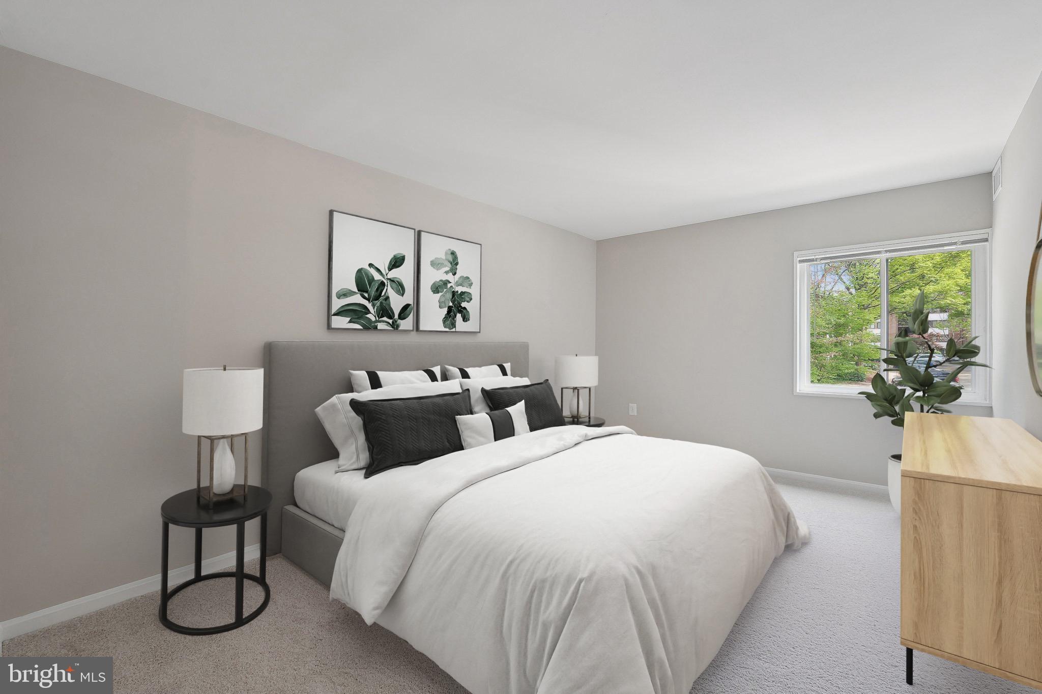 1531 Northgate Square, Unit 12B Reston, VA 20190 - Photo 16 of 34 a bedroom with bed and a potted plant