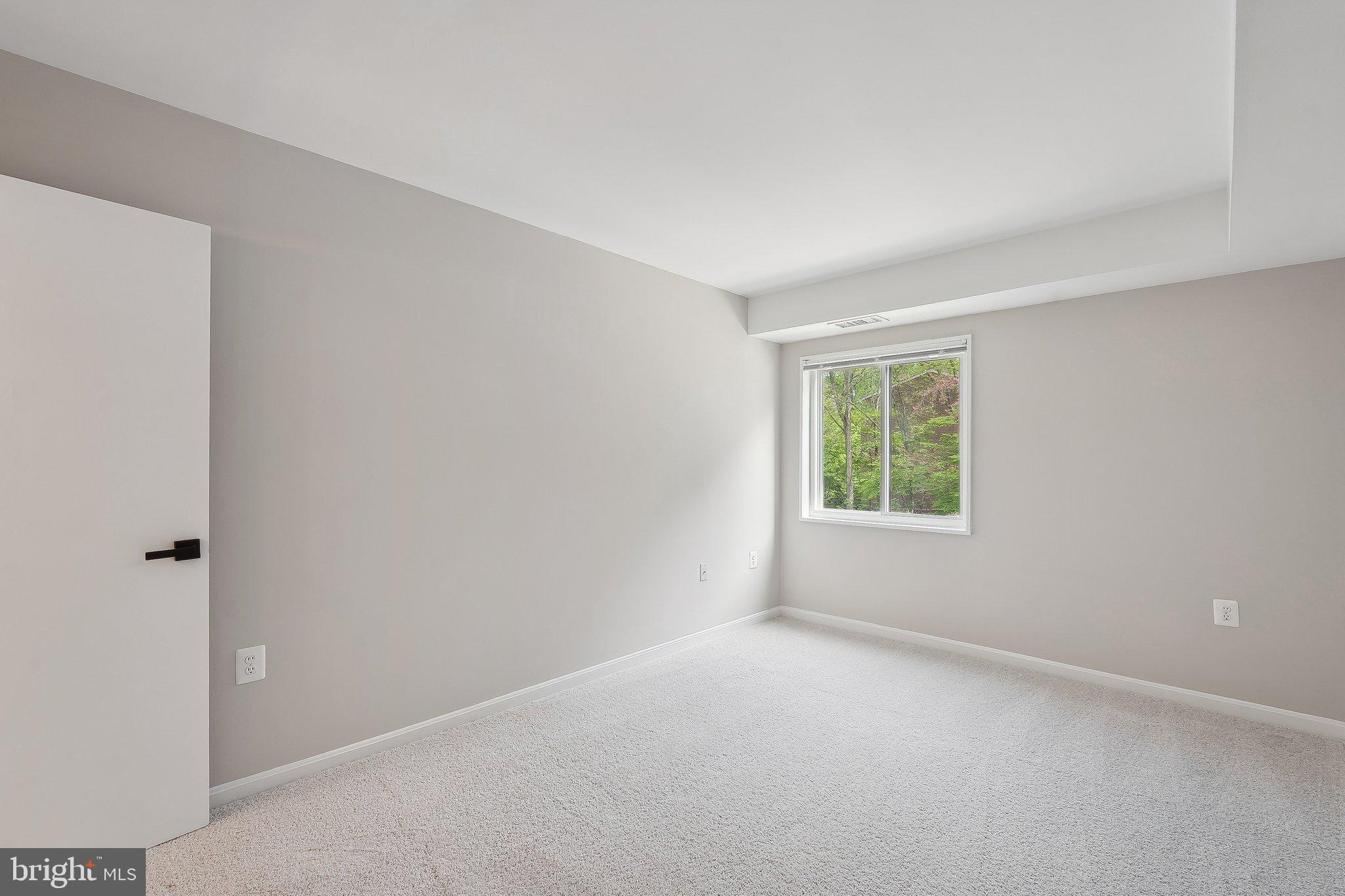 1531 Northgate Square, Unit 12B Reston, VA 20190 - Photo 23 of 34 an empty room with windows