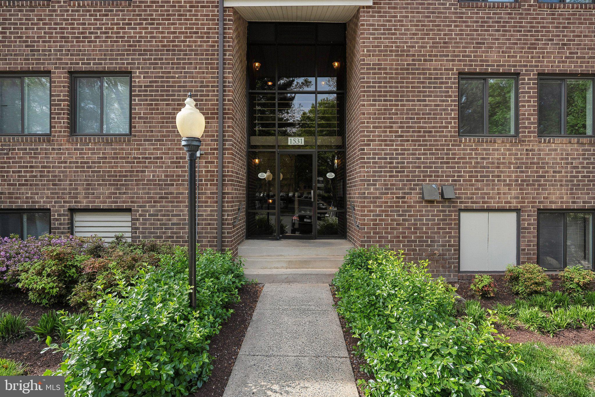 1531 Northgate Square, Unit 12B Reston, VA 20190 - Photo 26 of 34 a view of a pathway besides a house