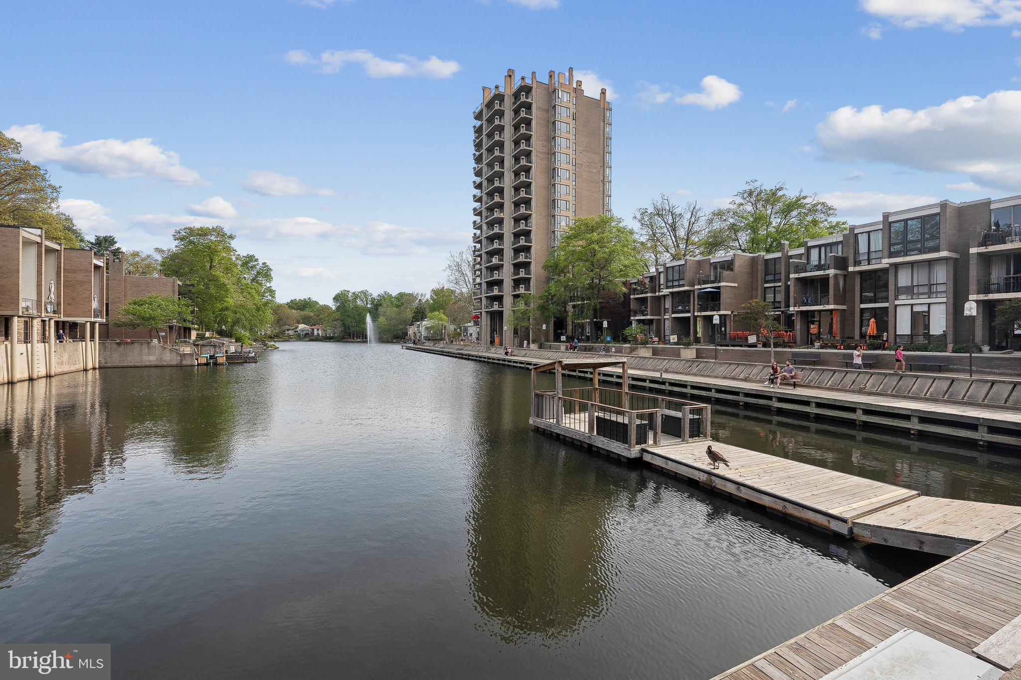 1531 Northgate Square, Unit 12B Reston, VA 20190 - Photo 27 of 34 a view of a lake with tall buildings