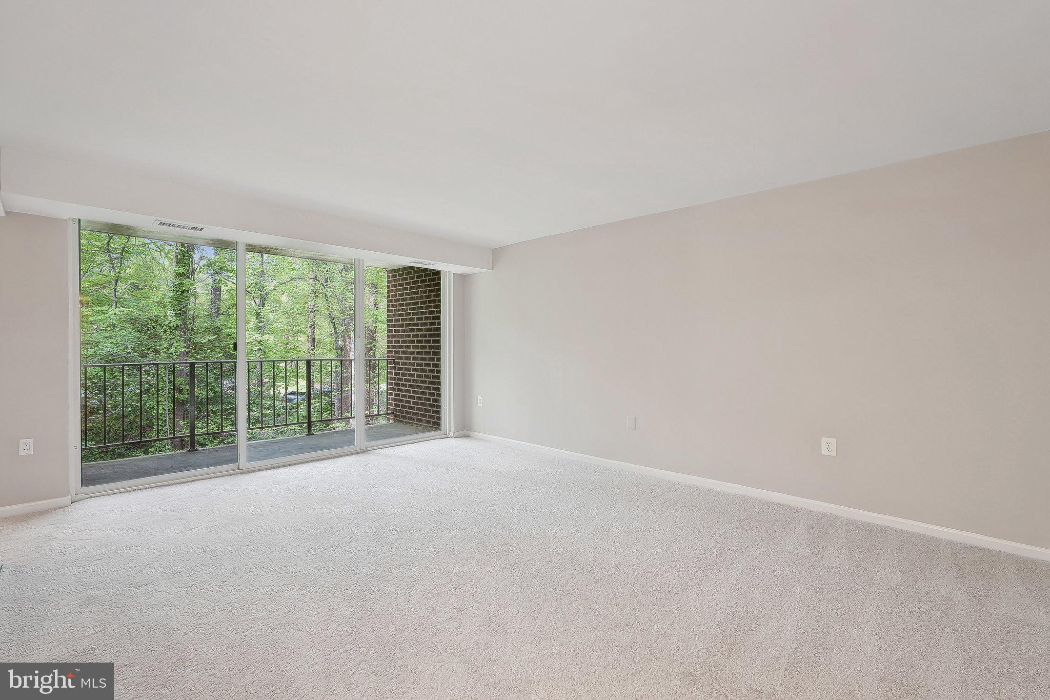 1531 Northgate Square, Unit 12B Reston, VA 20190 - Photo 3 of 34 a view of a big room with an empty room and large windows