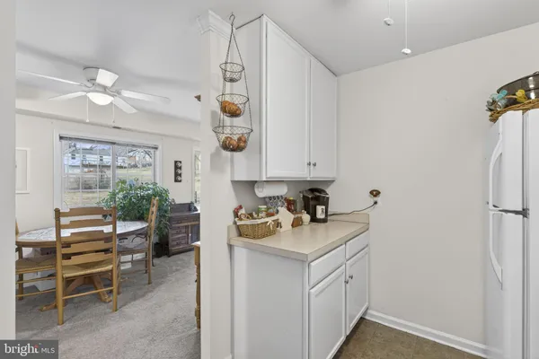 a kitchen with a sink appliances and cabinets