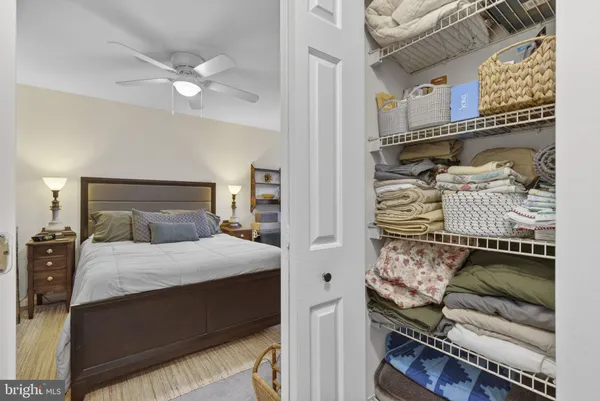 a bedroom with bed and window