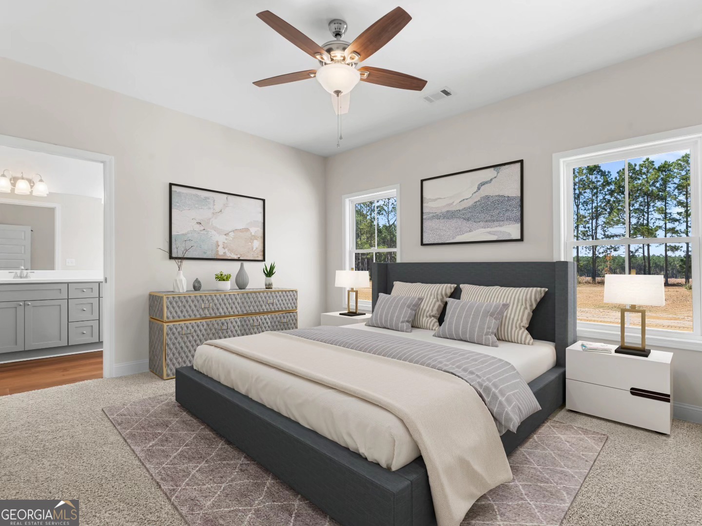 2075 Old Register Road Statesboro, GA 30458 - Photo 10 of 11 a bedroom with a large bed and a chandelier