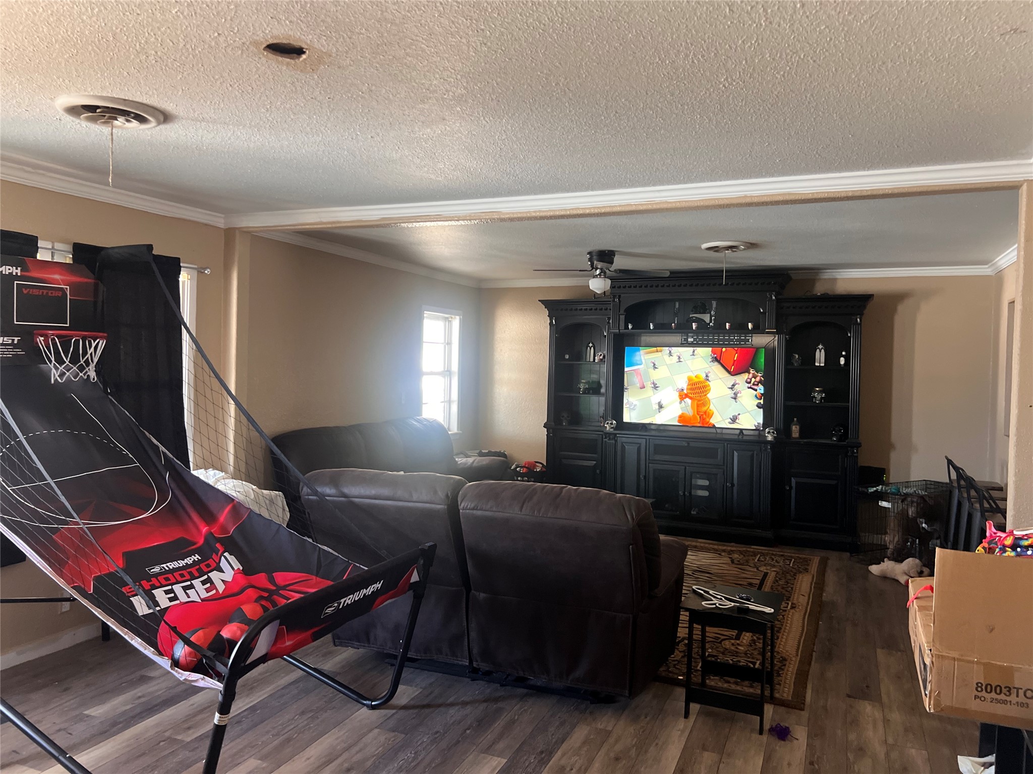 513 Scott Street Tye, TX 79563 - Photo 2 of 16 a living room with furniture and a flat screen tv
