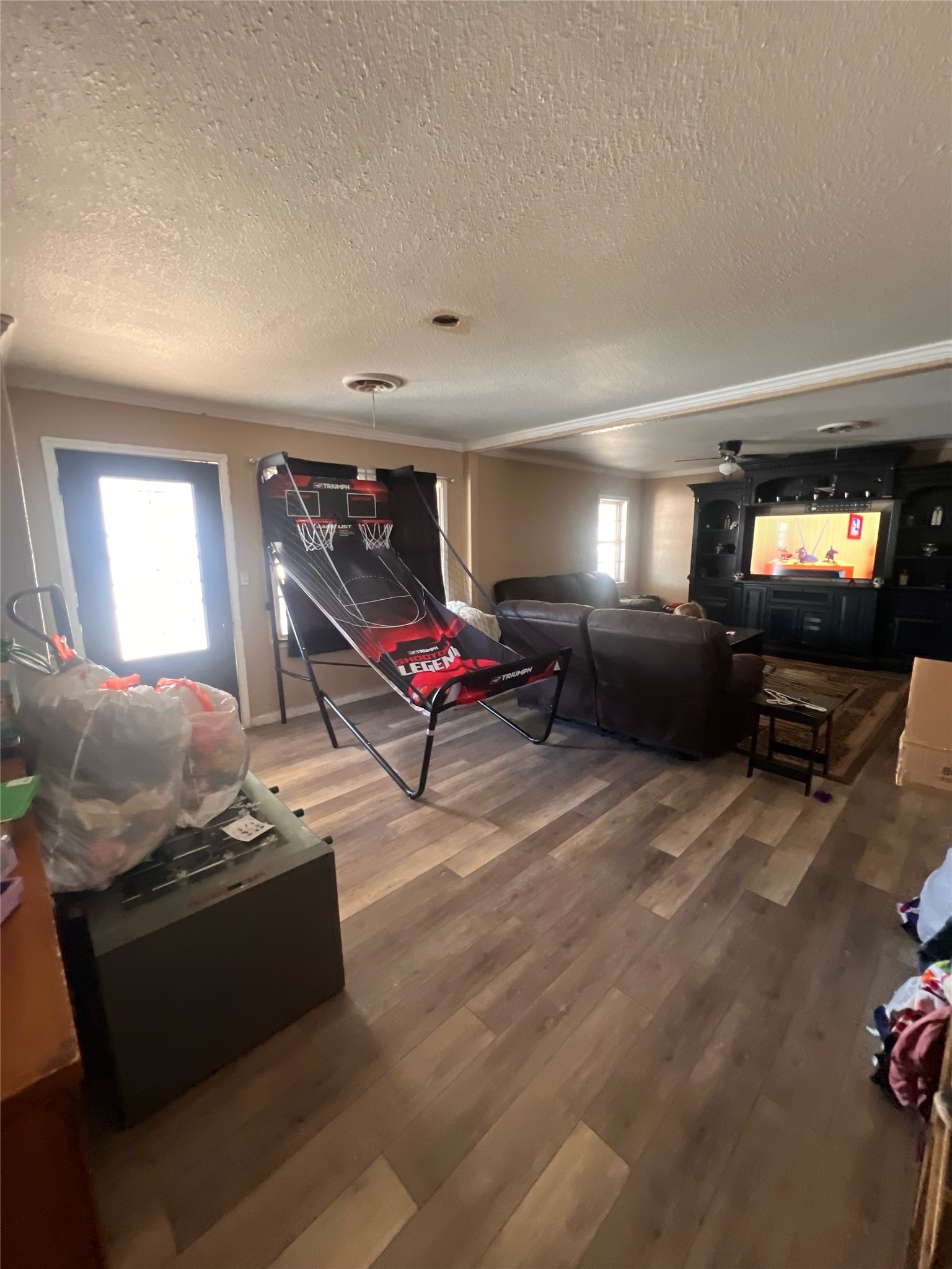 513 Scott Street Tye, TX 79563 - Photo 3 of 16 a living room with furniture gym equipment and a flat screen tv