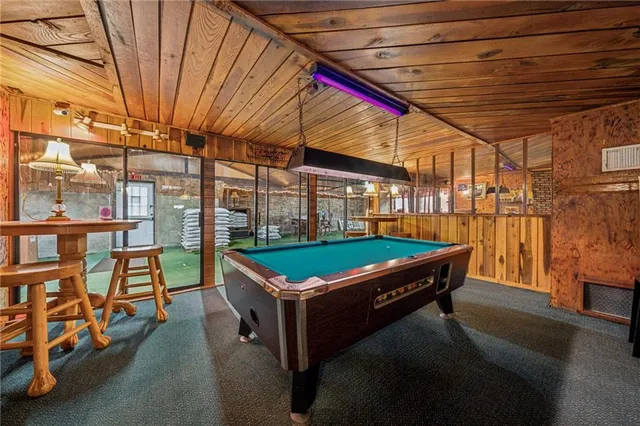 a view of a room with wooden walls