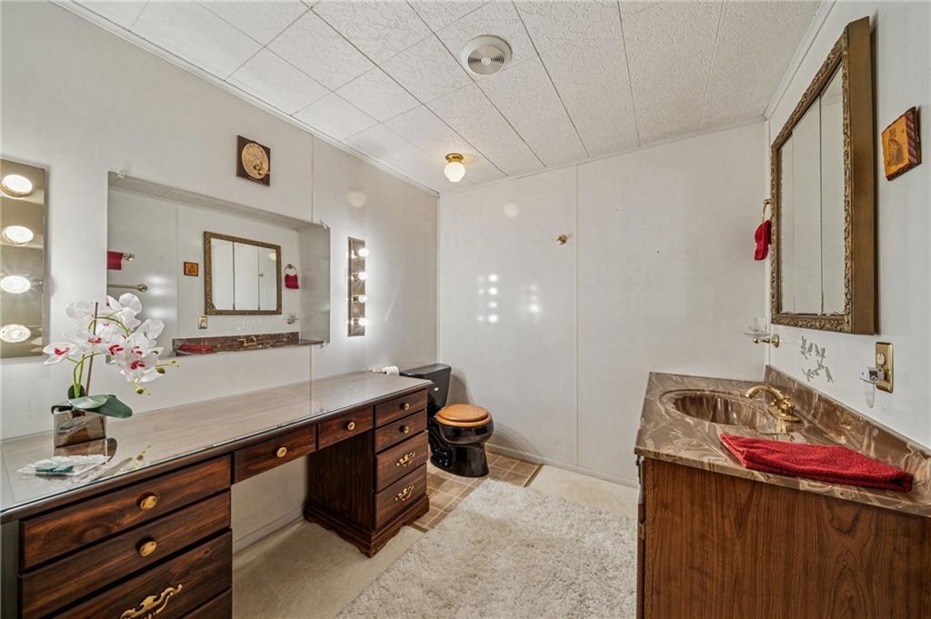608 North Chestnut Street Derry, PA 15627 - Photo 26 of 50 a bathroom with a sink and a mirror