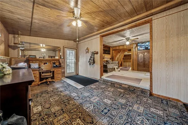 a view of an empty room with furniture