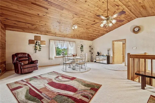 a spacious bathroom with a tub and window