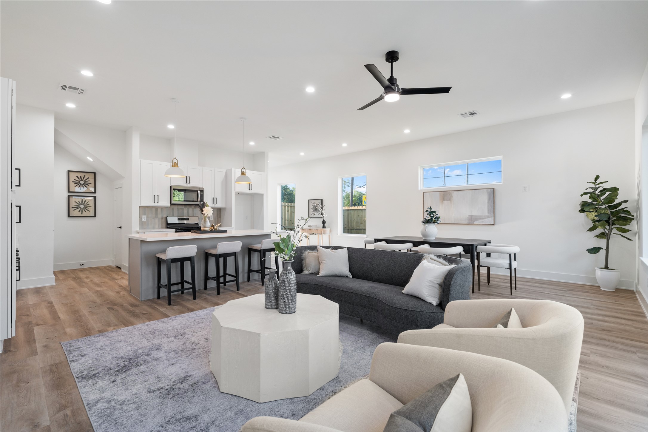 9003 Comal Street Houston, TX 77051 - Photo 15 of 36 This angle showcases just how expansive the first floor is, highlighting the open layout and spacious design. Natural light flows freely throughout, emphasizing the airy, welcoming atmosphere. The generous space makes it easy to imagine daily life, entertaining, and gatherings in comfort.