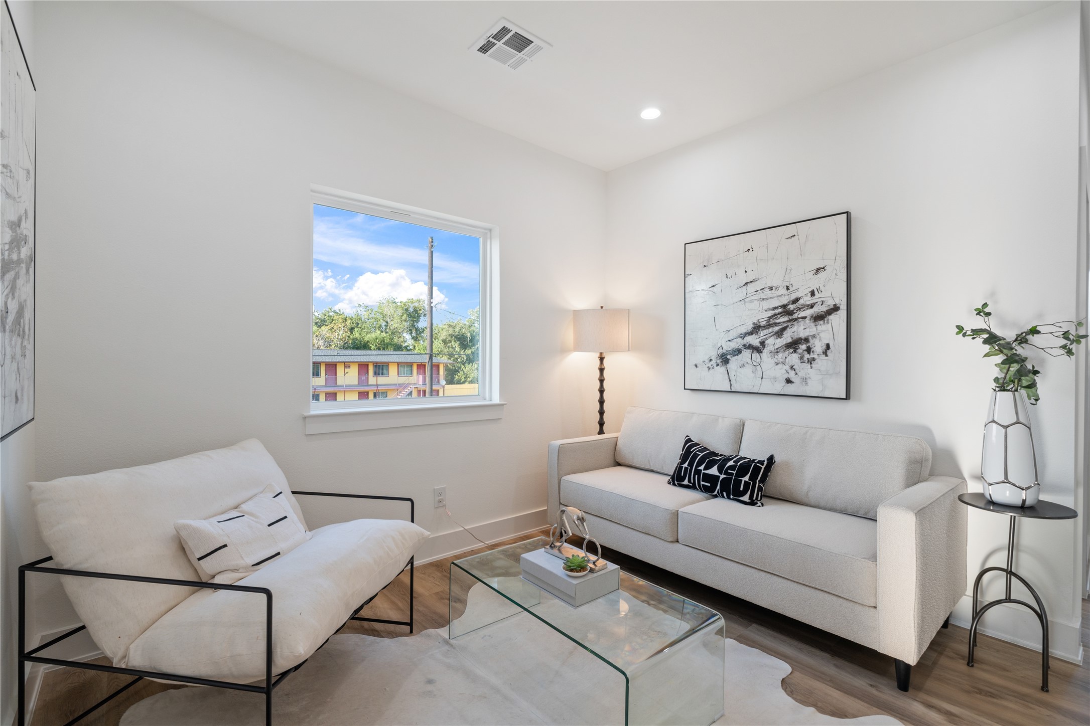 9003 Comal Street Houston, TX 77051 - Photo 19 of 36 Upstairs offers a flexible space that can serve as a secondary living area, playroom, or home office. Its open design provides a versatile spot for family activities or quiet relaxation. This adaptable area adds functionality and extra living space to the home.