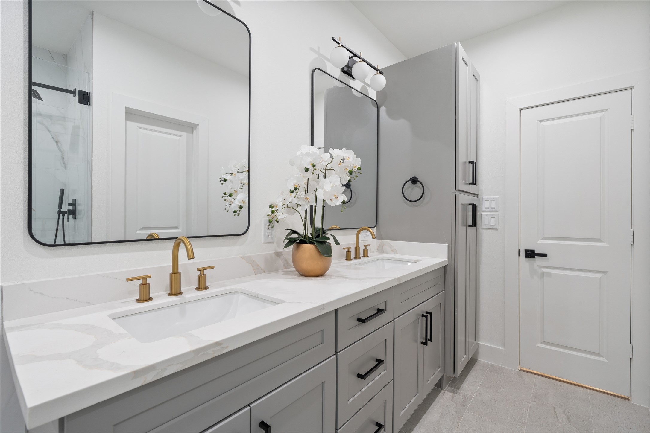 9003 Comal Street Houston, TX 77051 - Photo 26 of 36 The primary ensuite offers expansive counter space, providing plenty of room for you and your partner to comfortably get ready. Combined with abundant storage, it keeps the space organized and functional. This thoughtful design enhances both convenience and luxury in your daily routine.