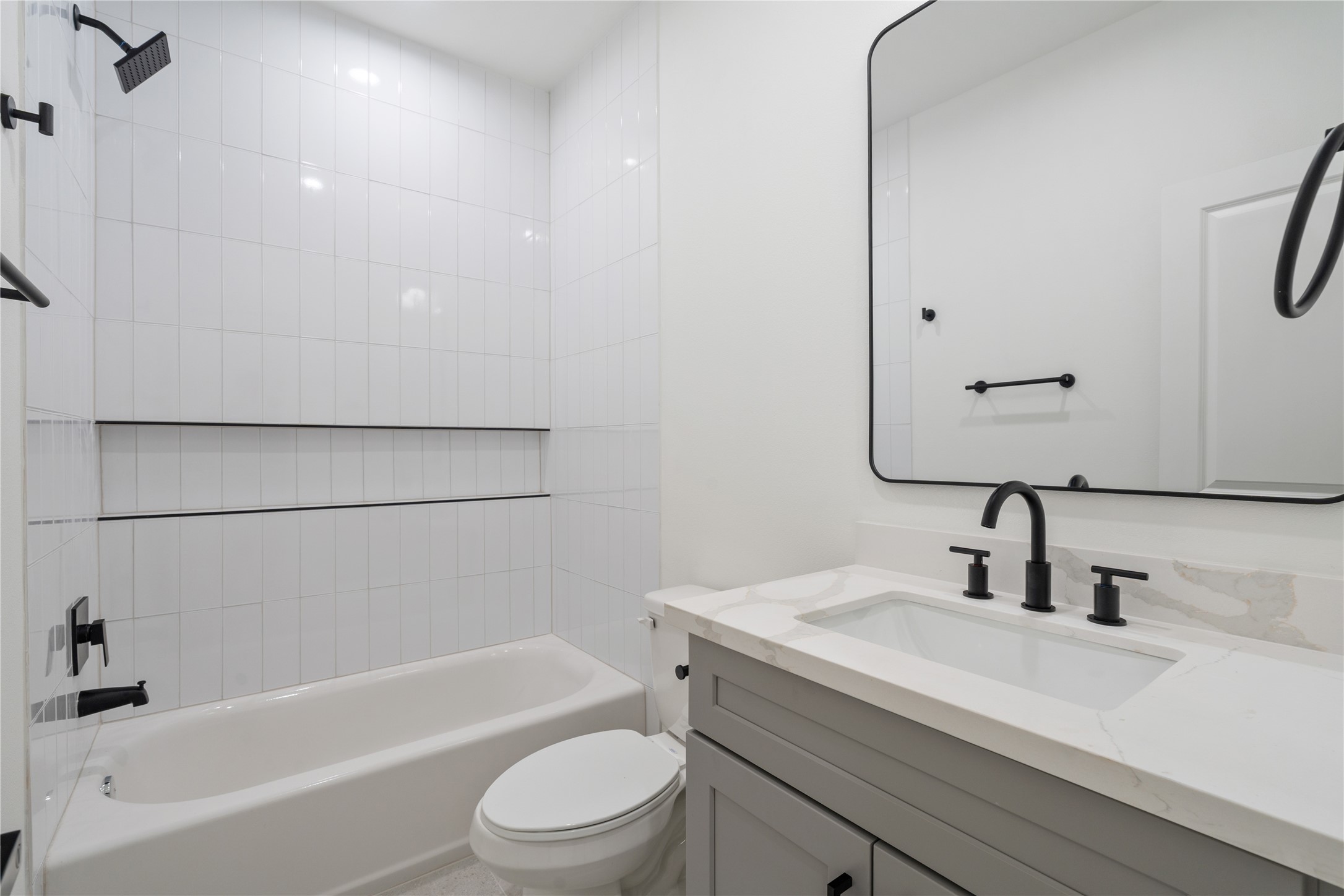 9003 Comal Street Houston, TX 77051 - Photo 32 of 36 Each bedroom features its own full bathroom, offering privacy and convenience for family members and guests. This thoughtful design enhances comfort and functionality throughout the home. It ensures every space feels complete, stylish, and independently accommodating.