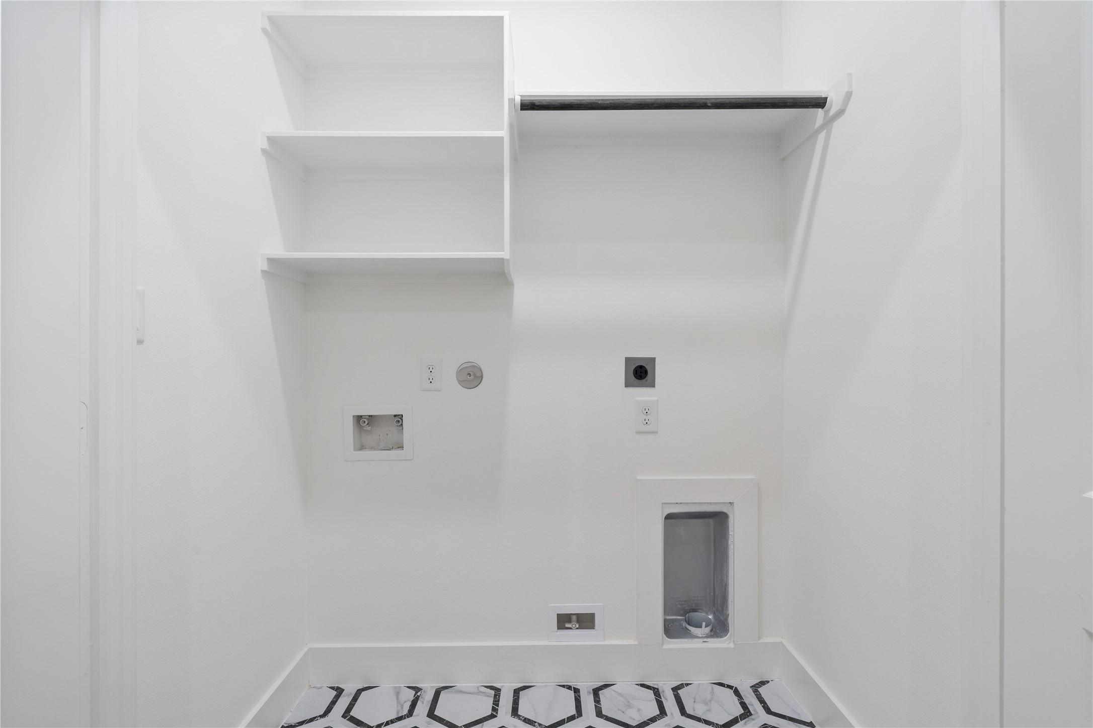 9003 Comal Street Houston, TX 77051 - Photo 33 of 36 The utility room offers ample storage and functional space for laundry and organization. Its generous layout makes household tasks easy and efficient. This practical area combines convenience with thoughtful design, keeping the home organized and clutter-free.