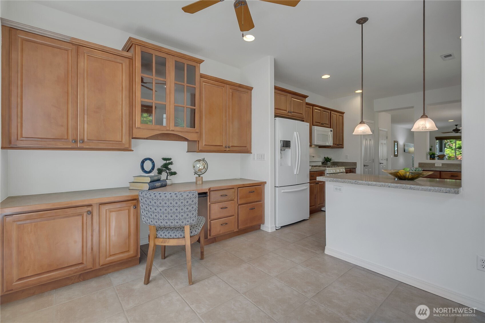 4961 Spokane Street Northeast Lacey, WA 98516 - Photo 13 of 38 a kitchen with white cabinets and white appliances