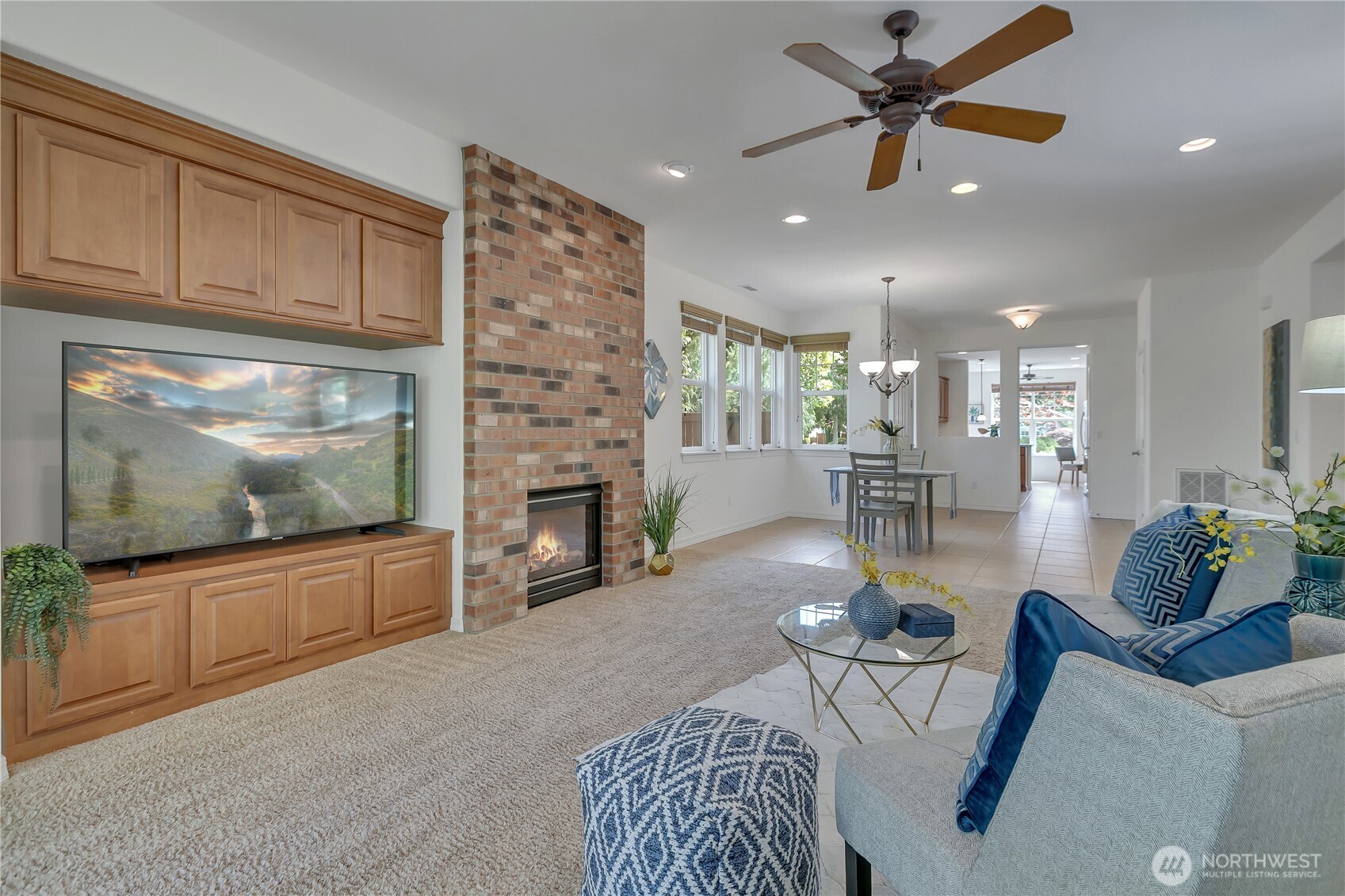 4961 Spokane Street Northeast Lacey, WA 98516 - Photo 14 of 38 a living room with furniture and a flat screen tv