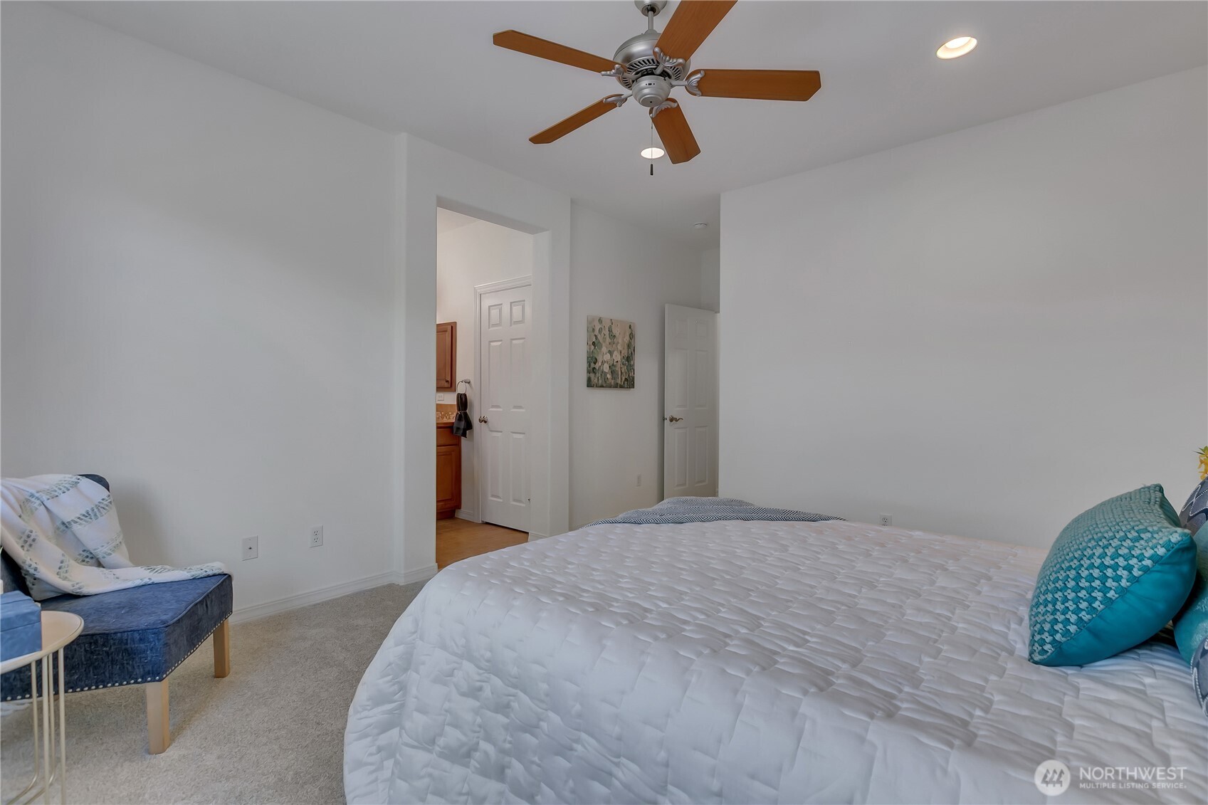 4961 Spokane Street Northeast Lacey, WA 98516 - Photo 20 of 38 a bedroom with a bed and a chair